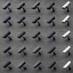 Many surveillance cameras on a wall