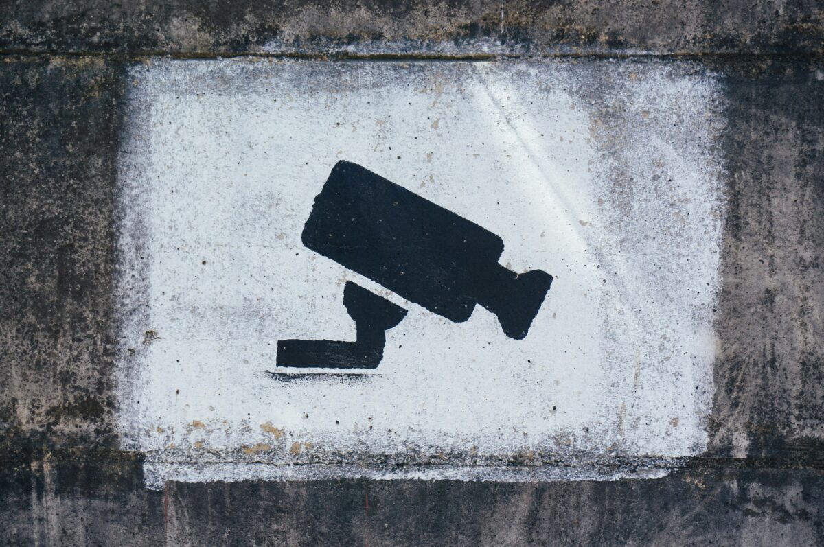 Image of surveillance camera painted on a wall