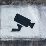 Image of surveillance camera painted on a wall