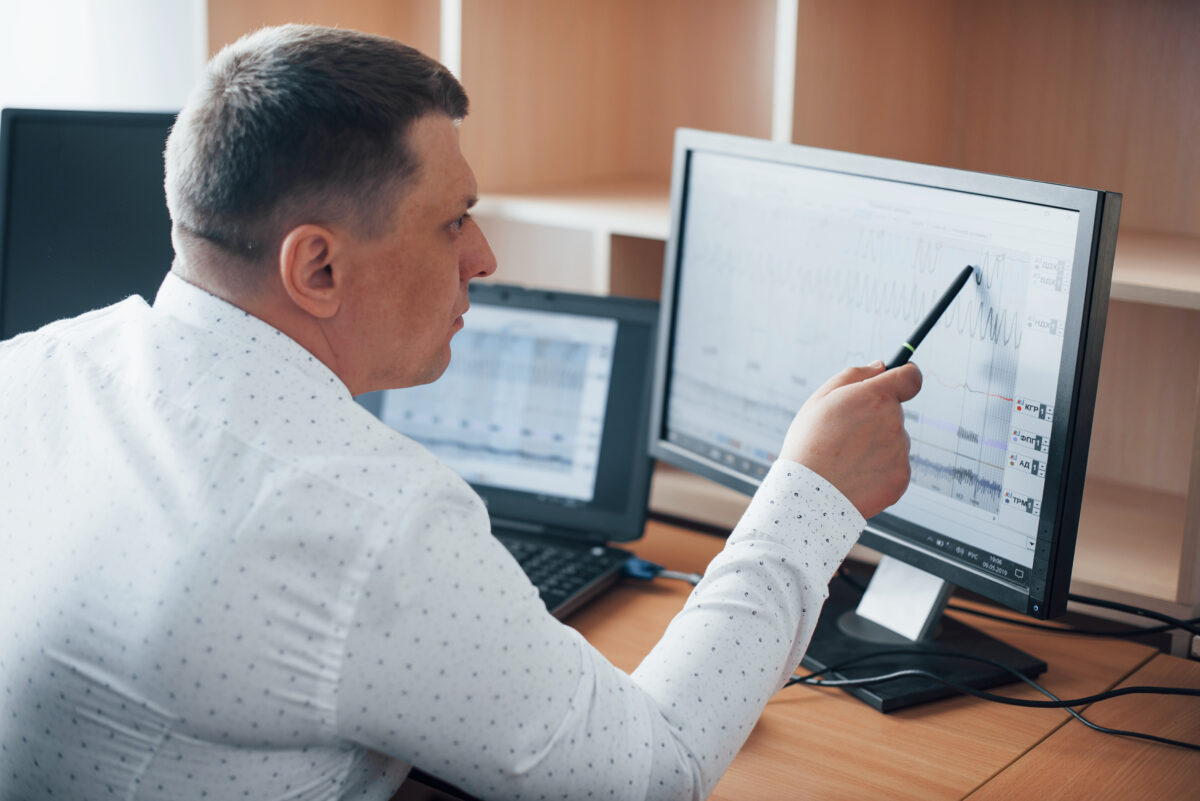 An operator examining log files on a computer screen