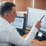 An operator examining log files on a computer screen